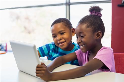 Two students on a tablet 